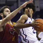 
              TCU guard PJ Haggerty (3) goes to the basket as Louisiana-Monroe forward Victor Bafutto (14) defends during the first half of an NCAA college basketball game Thursday, Nov. 17, 2022, in Fort Worth, Texas. (AP Photo/Ron Jenkins)
            