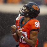 
              Oklahoma State wide receiver Brennan Presley celebrates during the second half of the NCAA college football game against West Virginia in Stillwater, Okla., Saturday Nov. 26, 2022. (AP Photo/Mitch Alcala)
            