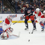 
              Montreal Canadiens' Sam Montembeault, left, makes a save against the Columbus Blue Jackets during the second period of an NHL hockey game Thursday, Nov. 17, 2022, in Columbus, Ohio. (AP Photo/Jay LaPrete)
            
