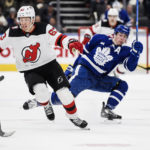 
              Toronto Maple Leafs right wing Mitchell Marner (16) and New Jersey Devils left wing Jesper Bratt (63) collide during the second period of an NHL hockey game Thursday, Nov. 17, 2022, in Toronto. (Christopher Katsarov/The Canadian Press via AP)
            