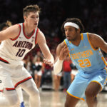 
              Southern University guard Bryson Etienne (23) drives against Arizona forward Azuolas Tubelis during the first half of an NCAA college basketball game, Friday, Nov. 11, 2022, in Tucson, Ariz. (AP Photo/Rick Scuteri)
            