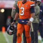 
              Denver Broncos quarterback Russell Wilson (3) reacts on the sideline during the first half of an NFL football game against the Las Vegas Raiders in Denver, Sunday, Nov. 20, 2022. (AP Photo/Jack Dempsey)
            
