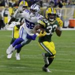 
              Green Bay Packers running back Aaron Jones (33) sprints past Dallas Cowboys defensive end Dante Fowler Jr. (56) as he heads to the end zone to score a touchdown during the first half of an NFL football game Sunday, Nov. 13, 2022, in Green Bay, Wis. (AP Photo/Mike Roemer)
            