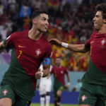 
              Portugal's Cristiano Ronaldo, left, celebrates with teammate Joao Felix after scoring from the penalty spot his side's opening goal against Ghana during a World Cup group H soccer match at the Stadium 974 in Doha, Qatar, Thursday, Nov. 24, 2022. (AP Photo/Manu Fernandez)
            