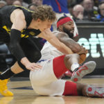 
              Los Angeles Clippers forward Marcus Morris Sr., right, grabs a loose ball as Utah Jazz forward Lauri Markkanen reach for it during the first half of an NBA basketball game Sunday, Nov. 6, 2022, in Los Angeles. (AP Photo/Mark J. Terrill)
            