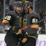 
              Vegas Golden Knights right wing Keegan Kolesar (55) celebrates after left wing William Carrier (28) scored against the Ottawa Senators during the second period of an NHL hockey game Wednesday, Nov. 23, 2022, in Las Vegas. (AP Photo/John Locher)
            