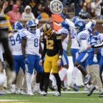 
              Kentucky teammates celebrate after they recovered a fumble by Missouri quarterback Brady Cook, center, during the second quarter of an NCAA college football game Saturday, Nov. 5, 2022, in Columbia, Mo. (AP Photo/L.G. Patterson)
            