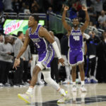 
              Sacramento Kings guard De'Aaron Fox (5) celebrates with his team after his 3-point final shot against the Orlando Magic during overtime of an NBA basketball game, Saturday, Nov. 5, 2022, in Orlando, Fla. (AP Photo/Kevin Kolczynski)
            