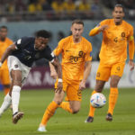 
              Teun Koopmeiners, centre, and Virgil van Dijk of the Netherlands challenge for the ball with Ecuador's Michael Estrada, left, during the World Cup group A soccer match between the Netherlands and Ecuador at the Khalifa International Stadium in Doha, Qatar, Friday, Nov. 25, 2022. (AP Photo/Darko Vojinovic)
            