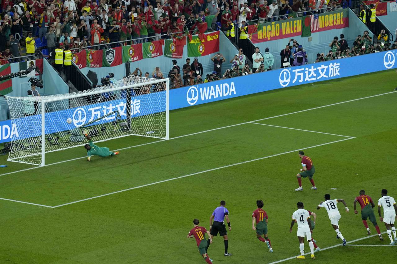 Portugal's Cristiano Ronaldo scores from the penalty spot during the World Cup group H soccer match...