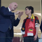 
              Belgium Foreign Minister Hadja Lahbib, wearing a "One Love" armband, talks with FIFA President Gianni Infantino, left, on the tribune during the World Cup group F soccer match between Belgium and Canada, at the Ahmad Bin Ali Stadium in Doha, Qatar, Wednesday, Nov. 23, 2022. (AP Photo/Natacha Pisarenko)
            