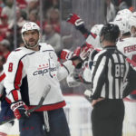 
              Washington Capitals left wing Alex Ovechkin greets teammates after scoring during the second period of an NHL hockey game against the Detroit Red Wings, Thursday, Nov. 3, 2022, in Detroit. (AP Photo/Carlos Osorio)
            