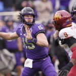 
              TCU quarterback Max Duggan (15) passes with blocking from teammate offensive tackle Andrew Coker against Iowa State defensive end Will McDonald IV (9) during the first quarter of an NCAA college football game in Fort Worth, Texas, Saturday, Nov. 26, 2022. (AP Photo/LM Otero)
            