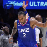 
              Los Angeles Clippers forward Kawhi Leonard gestures after scoring during the second half of an NBA basketball game against the Los Angeles Lakers Thursday, Oct. 20, 2022, in Los Angeles. (AP Photo/Mark J. Terrill)
            