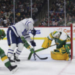 
              Toronto Maple Leafs center David Kampf (64) tries to score a goal against Minnesota Wild goaltender Marc-Andre Fleury (29) during the second period of an NHL hockey game Friday, Nov. 25, 2022, in St. Paul, Minn. (AP Photo/Stacy Bengs)
            