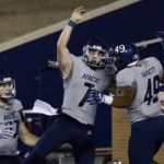 
              Rice quarterback TJ McMahon, center, and fullback Micah Barnett, right, celebrate a touchdown by McMahon against UTEP during the first half of an NCAA college football game Thursday, Nov. 3, 2022, in Houston. At left is tight end Jack Bradley. (AP Photo/Michael Wyke)
            