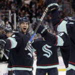 
              Seattle Kraken defenseman Justin Schultz (4) reacts after scoring in overtime against the New York Rangers during an NHL hockey game Thursday, Nov. 17, 2022, in Seattle. (AP Photo/John Froschauer)
            