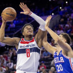 
              Washington Wizards forward Rui Hachimura (8) eyes the basket as Philadelphia 76ers forward Georges Niang (20) defends during the first half on an NBA basketball game Wednesday, Nov. 2, 2022, in Philadelphia. (AP Photo/Laurence Kesterson)
            