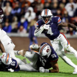 
              Auburn running back Tank Bigsby (4) carries the ball against Texas A&M during the first half of an NCAA college football game, Saturday, Nov. 12, 2022, in Auburn, Ala. (AP Photo/Butch Dill)
            