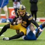 
              Missouri quarterback Brady Cook (12) is sacked by Kentucky's Trevin Wallace during the second quarter of an NCAA college football game Saturday, Nov. 5, 2022, in Columbia, Mo. (AP Photo/L.G. Patterson)
            
