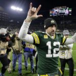 
              Green Bay Packers quarterback Aaron Rodgers (12) celebrates as he walks off the field following the team's 31-28 overtime win in an NFL football game against the Dallas Cowboys Sunday, Nov. 13, 2022, in Green Bay, Wis. (AP Photo/Mike Roemer)
            