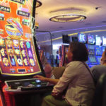 
              Gamblers play slot machines at the Hard Rock Casino in Atlantic City, N.J., on Aug. 8, 2022. Figures released on Nov. 9, 2022, by the American Gaming Association show the U.S. commercial casino industry had its best quarter ever, winning over $15 billion from gamblers in the third quarter of this year. (AP Photo/Wayne Parry)
            