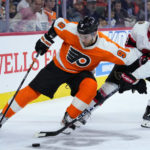 
              Philadelphia Flyers' Ivan Provorov, left, and Ottawa Senators' Tim Stützle battle for the puck during the first period of an NHL hockey game, Saturday, Nov. 12, 2022, in Philadelphia. (AP Photo/Matt Slocum)
            