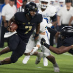 
              Army quarterback Jemel Jones (7) carries the ball during an NCAA college football game against Air Force in Arlington, Texas, Saturday, Nov. 5, 2022. (AP Photo/Emil Lippe)
            