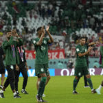 
              Saudi Arabia players applaud fans at the end of the World Cup group C soccer match between Poland and Saudi Arabia, at the Education City Stadium in Al Rayyan , Qatar, Saturday, Nov. 26, 2022. (AP Photo/Francisco Seco)
            