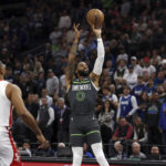 
              Minnesota Timberwolves guard D'Angelo Russell (0) shoots against the Houston Rockets during the first half of an NBA basketball game Saturday, Nov. 5, 2022, in Minneapolis. (AP Photo/Stacy Bengs)
            