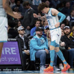 
              Charlotte Hornets guard LaMelo Ball reacts after being shaken up on a play during the second half of the tema's NBA basketball game against the Indiana Pacers in Charlotte, N.C., Wednesday, Nov. 16, 2022. (AP Photo/Jacob Kupferman)
            
