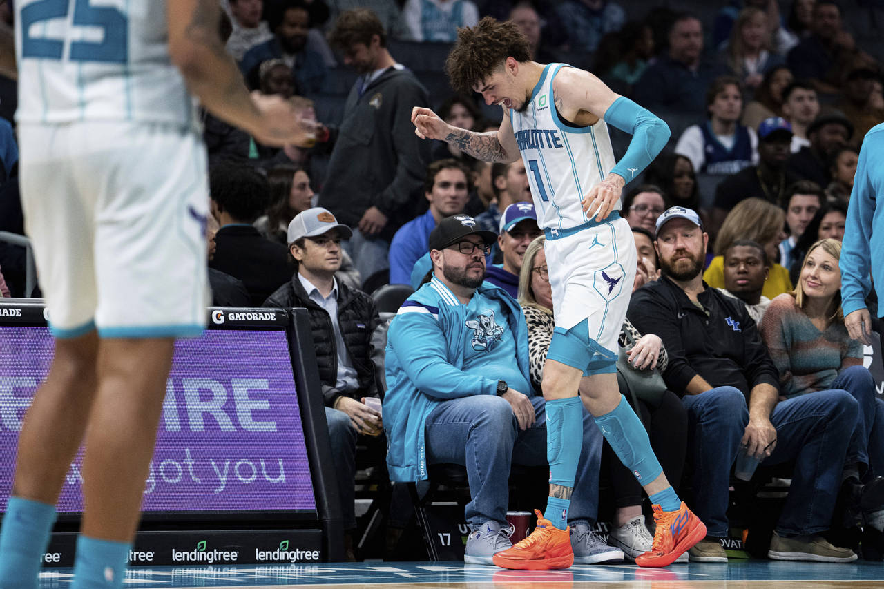 Charlotte Hornets guard LaMelo Ball reacts after being shaken up on a play during the second half o...