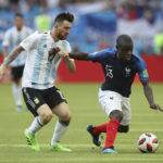 
              FILE - France's Ngolo Kante, right, fends off a challenge from Argentina's Lionel Messi during the round of 16 match between France and Argentina, at the 2018 soccer World Cup at the Kazan Arena in Kazan, Russia, Saturday, June 30, 2018. (AP Photo/Thanassis Stavrakis, File)
            