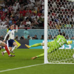 
              England's Phil Foden, center, scores past Wales' goalkeeper Danny Ward, right, his side's second goal during the World Cup group B soccer match between England and Wales, at the Ahmad Bin Ali Stadium in Al Rayyan , Qatar, Tuesday, Nov. 29, 2022. (AP Photo/Frank Augstein)
            