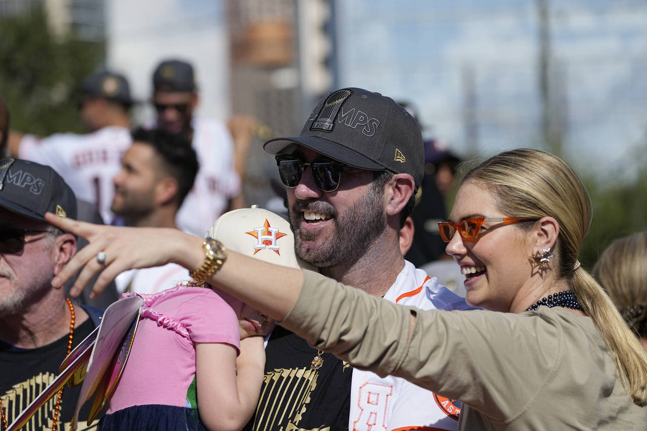 Houston Astros' Justin Verlander and his wife Kate Upton celebrate during a victory parade for the ...