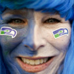 
              A fan of the Seahawks poses for a photo as she arrives for a NFL match between Tampa Bay Buccaneers and Seattle Seahawks at the Allianz Arena in Munich, Germany, Sunday, Nov. 13, 2022. (AP Photo/Markus Schreiber)
            