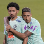 
              Brazil's Marquinhos, left, and Raphinha attend a training session at the Grand Hamad stadium in Doha, Qatar, Monday, Nov. 21, 2022. Brazil will play their first match in the World Cup against Serbia on Nov. 24. (AP Photo/Andre Penner)
            