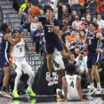 
              Virginia forward Kadin Shedrick (21) gets a rebound against Baylor during the first half of an NCAA college basketball game Friday, Nov. 18, 2022, in Las Vegas. (AP Photo/Chase Stevens)
            