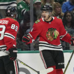 
              Chicago Blackhawks' Seth Jones (4) celebrates his goal Andreas Athanasiou (89) during the second period of the team's NHL hockey game against the Dallas Stars in Dallas, Wednesday, Nov. 23, 2022. (AP Photo/LM Otero)
            