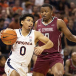 
              Virginia guard Kihei Clark (0) drives with the ball against North Carolina Central during the first half of an NCAA college basketball game in Charlottesville, Va., Monday, Nov. 7, 2022. (AP Photo/Mike Kropf)
            