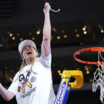 
              FILE - Louisville guard Hailey Van Lith (10) celebrates after help cut the net down after beating Michigan 62-50 in a college basketball game in the Elite 8 round of the NCAA women's tournament Monday, March 28, 2022, in Wichita, Kan. Some star women’s players have already decided to stay in school rather than make their earliest possible jump to the WNBA and more are on the way with NIL deals and chartered travel offering appeal compared to rookie salaries and commercial flights in the WNBA. (AP Photo/Jeff Roberson, File)
            