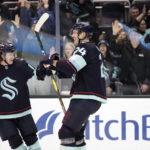 
              Seattle Kraken defenseman Jamie Oleksiak (24) celebrates his goal against the San Jose Sharks with left wing Jared McCann, left, and right wing Jordan Eberle during the second period of an NHL hockey game Wednesday, Nov. 23, 2022, in Seattle. (AP Photo/John Froschauer)
            