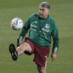 
              Mexico's coach Gerardo Martino plays a ball during a training session in Jor, Qatar, Wednesday, Nov. 23, 2022. (AP Photo/Moises Castillo)
            