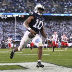 
              Penn State running back Nicholas Singleton (10) scores a touchdown against Maryland during the first half of an NCAA college football game, Saturday, Nov. 12, 2022, in State College, Pa. (AP Photo/Barry Reeger)
            