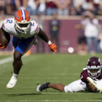 
              Florida running back Montrell Johnson Jr. (2) is tripped up by Texas A&M defensive back Tyreek Chappell (7) after running for a first down during the first quarter of an NCAA college football game Saturday, Nov. 5, 2022, in College Station, Texas. (AP Photo/Sam Craft)
            