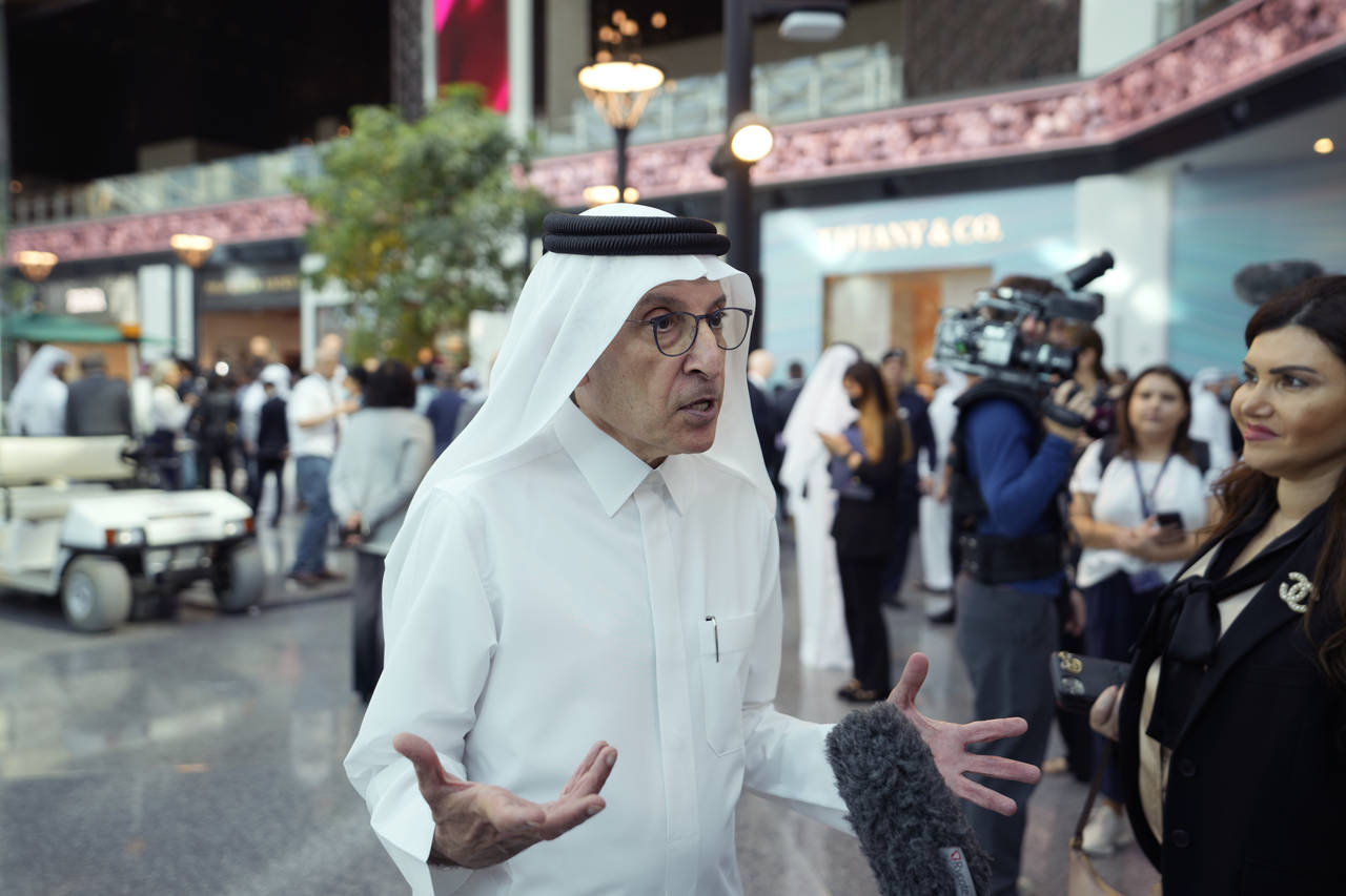 Qatar Airways CEO Akbar Al Baker speaks to a journalist at Hamad International Airportat the new ce...