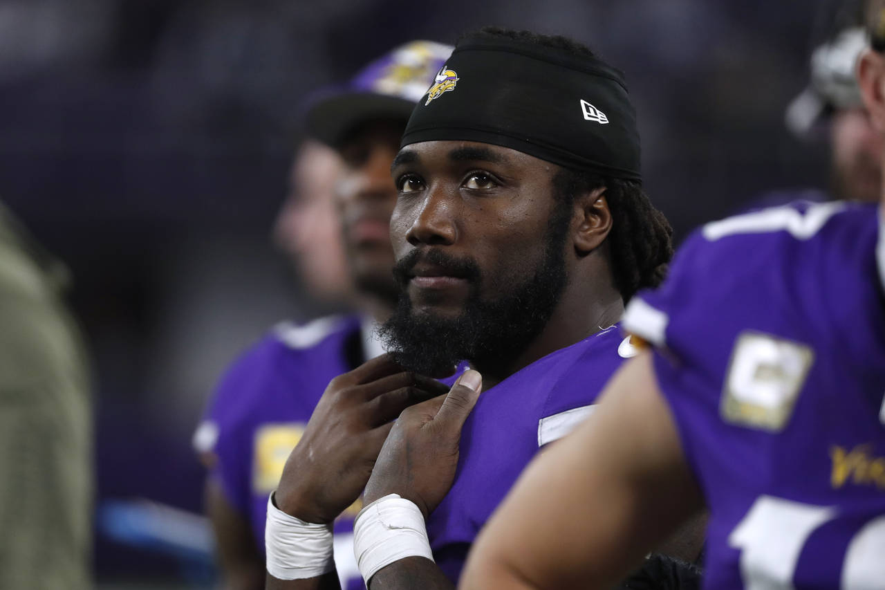 Minnesota Vikings running back Dalvin Cook watches from the sideline during the second half of an N...