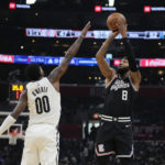
              Los Angeles Clippers forward Marcus Morris Sr. (8) shoots over Brooklyn Nets forward Royce O'Neale (00) during the first half of an NBA basketball game Saturday, Nov. 12, 2022, in Los Angeles. (AP Photo/Marcio Jose Sanchez)
            