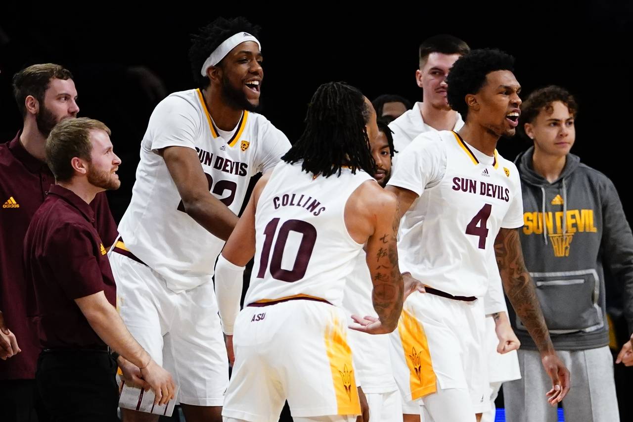 Arizona State's Desmond Cambridge Jr. (4) reacts after scoring during the second half of an NCAA co...