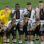 
              Germany's soccer team players cover their mouths as they pose for a group photo before the World Cup group E soccer match between Germany and Japan, at the Khalifa International Stadium in Doha, Qatar, Wednesday, Nov. 23, 2022. (AP Photo/Ricardo Mazalan)
            